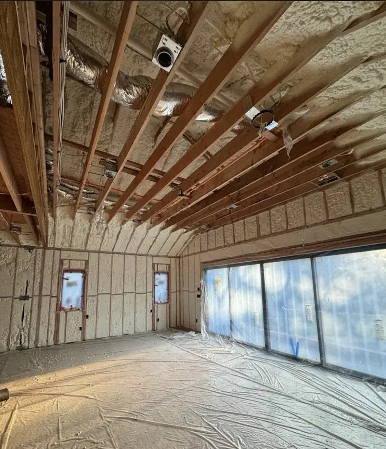 Interior walls and ceiling insulated with spray foam during new construction in North Haledon
